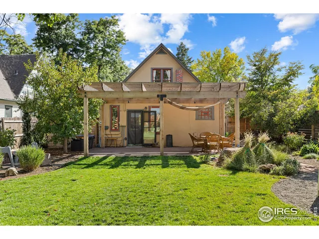 a view of a patio with table and chairs and potted plants