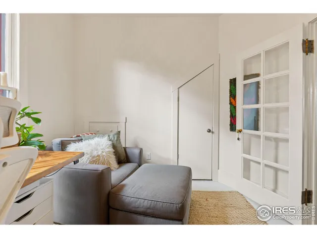 a dining room with a table and chairs