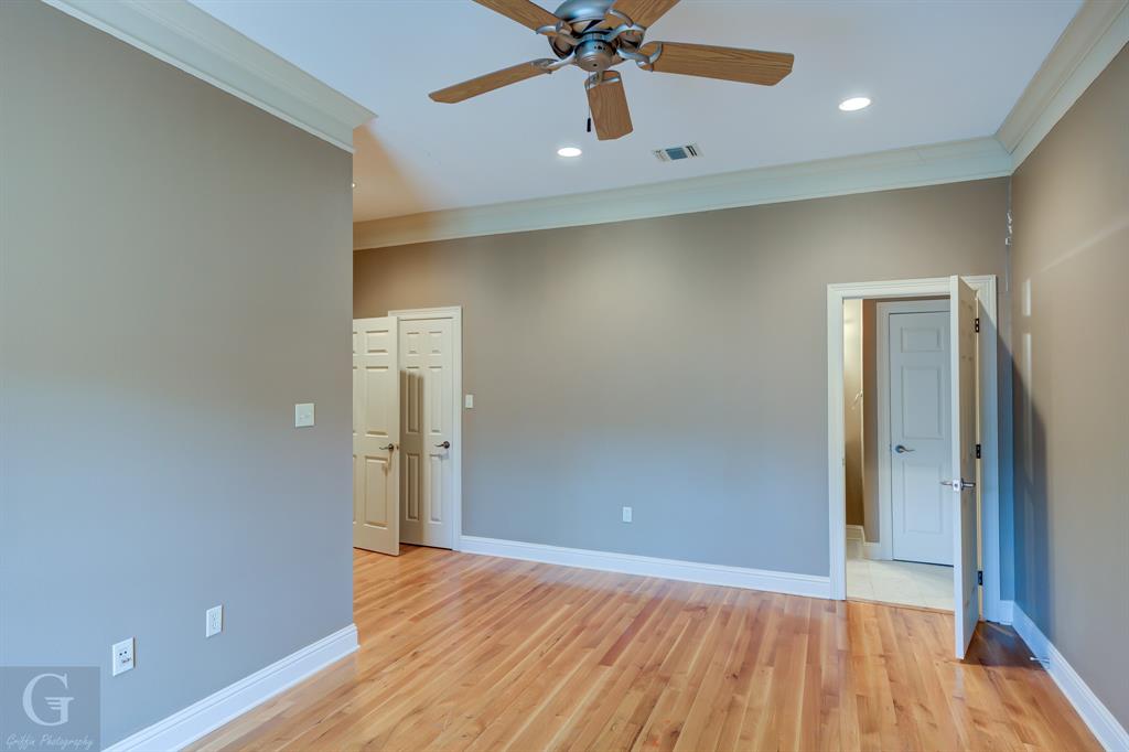1212 WPA Road Homer, LA 71040 - Photo 17 of 35 Empty room with crown molding, a ceiling fan, baseboards, light wood-style flooring, and recessed lighting