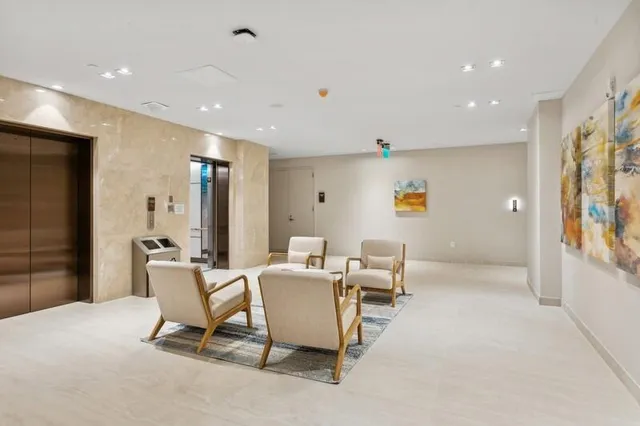 a view of a living room and a potted plant