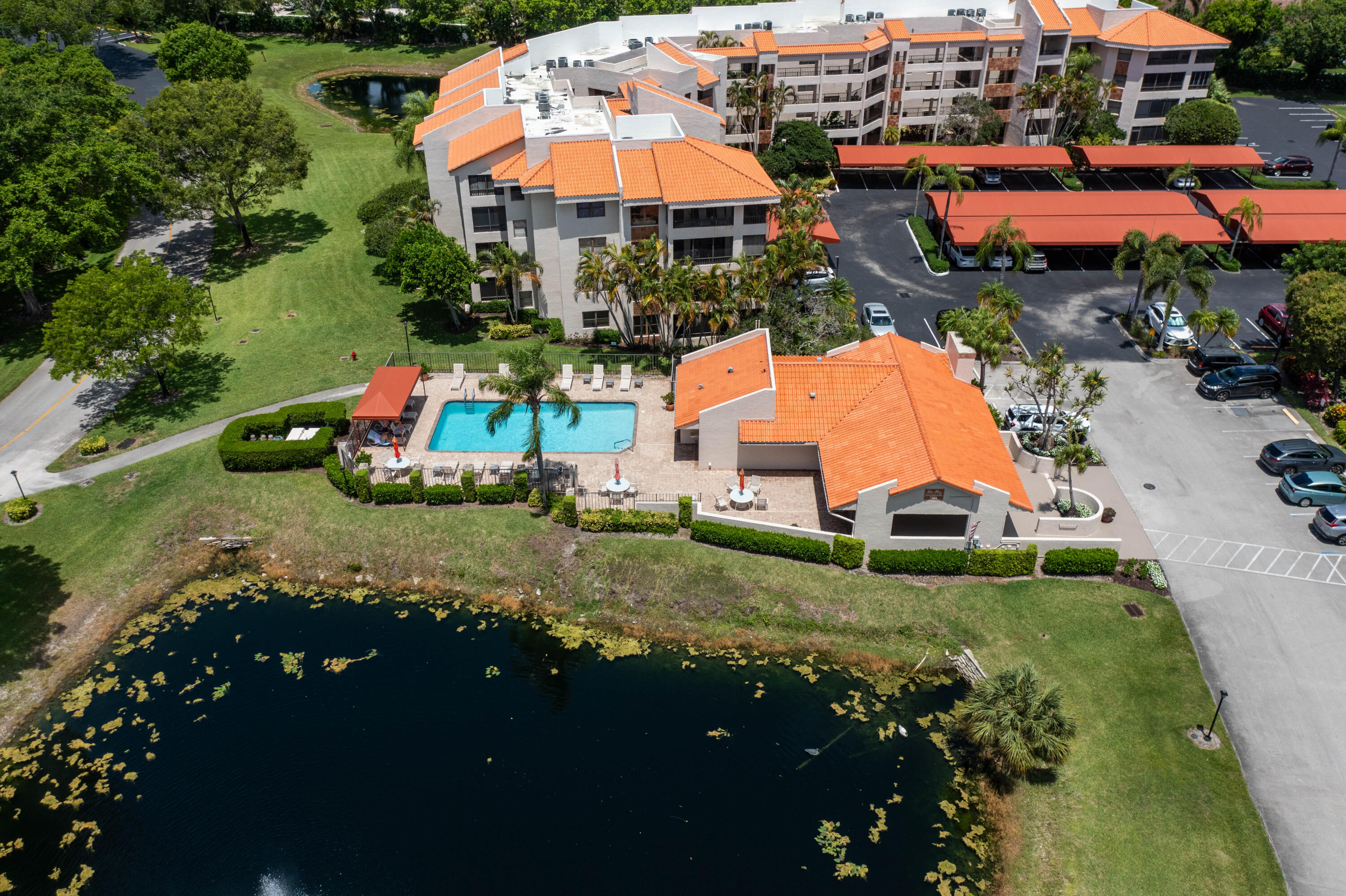 7520 La Paz Boulevard, Unit 104 Boca Raton, FL 33433 - Photo 43 of 56 an aerial view of residential houses with outdoor space and trees