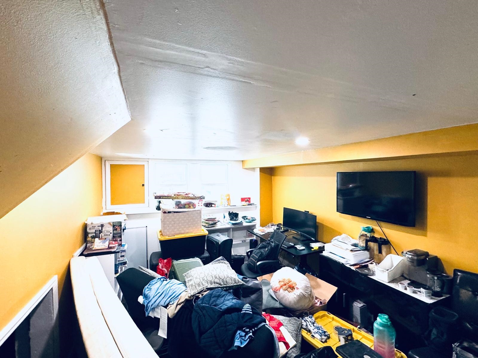 53 Harrison Street Dumont, NJ 07628 - Photo 11 of 28 a bed room with furniture and a flat screen tv