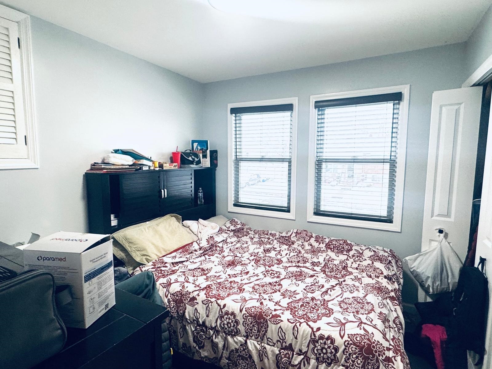 53 Harrison Street Dumont, NJ 07628 - Photo 13 of 28 a bed sitting in a bedroom next to a window