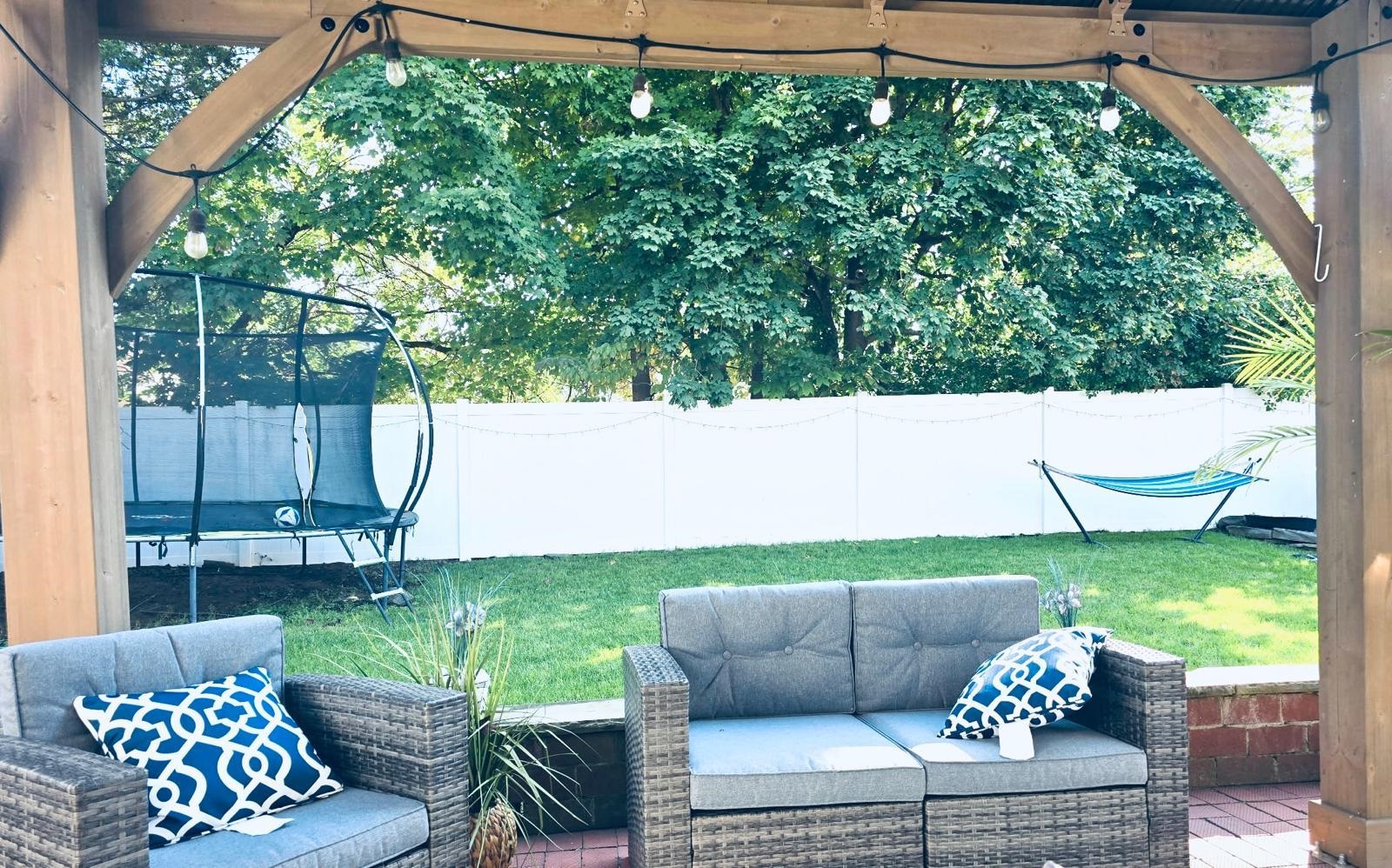 53 Harrison Street Dumont, NJ 07628 - Photo 25 of 28 a view of a couches in a patio with a yard