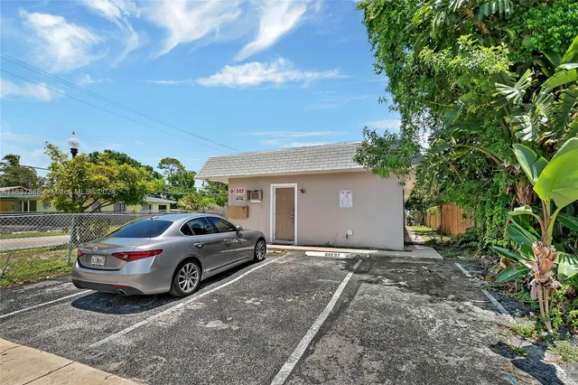 a view of a car parked in front of a house