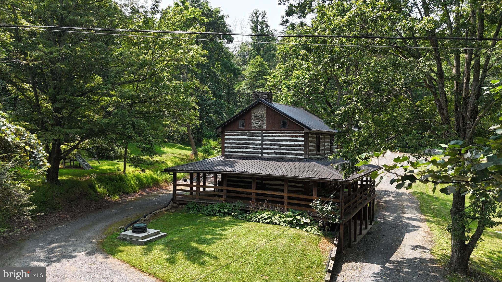 a backyard of a house with yard and outdoor seating