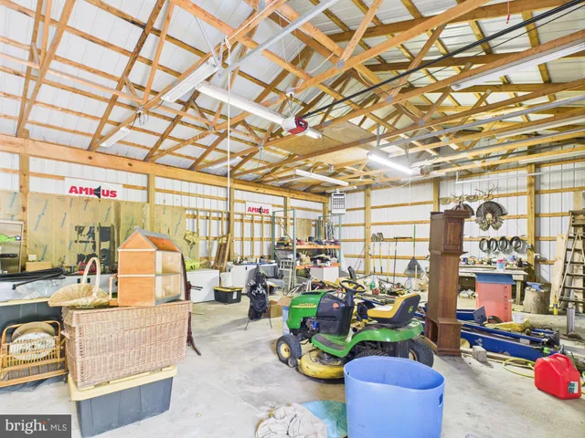 a living room with lots of furniture and a chandelier