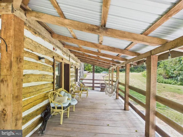 a front view of a house with outdoor seating
