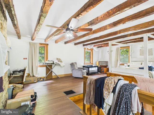 an aerial view of a house with pool yard and lake view