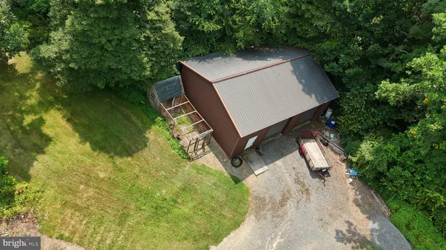 an aerial view of house with yard