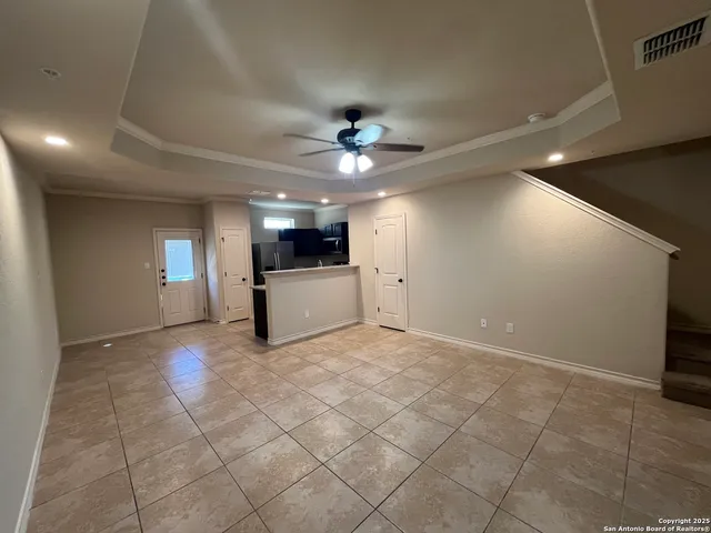 a view of a livingroom with a kitchen
