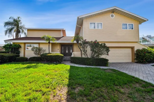 a front view of a house with a door and a mirror