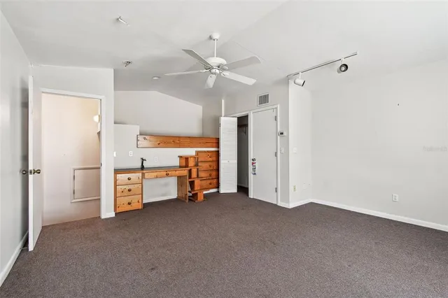 a view of swimming pool with a yard and plants