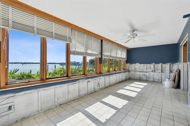 a view of a patio with table and chairs under an umbrella