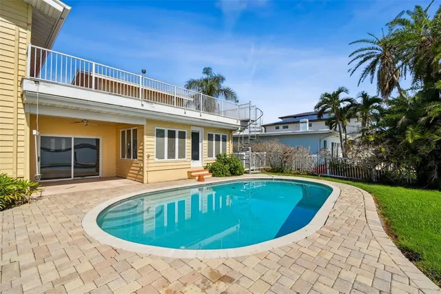an aerial view of a house with a lake view