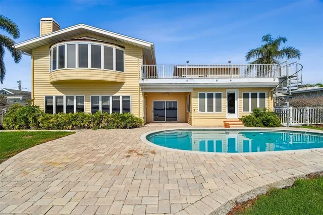 an aerial view of a house with a lake view