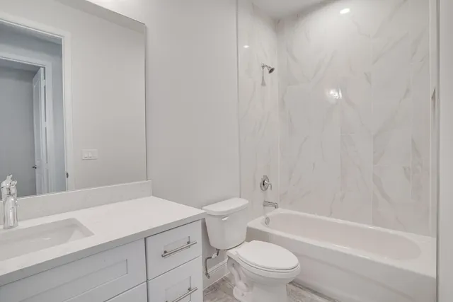 a bathroom with a sink a toilet and a bathtub