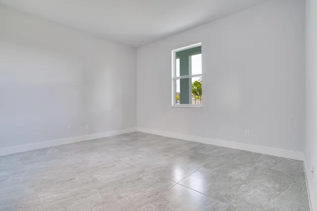 an empty room with windows and window