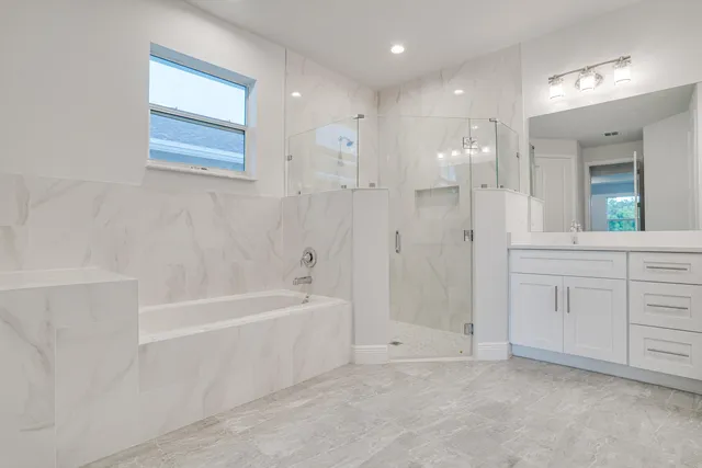 a bathroom with a bathtub and a toilet