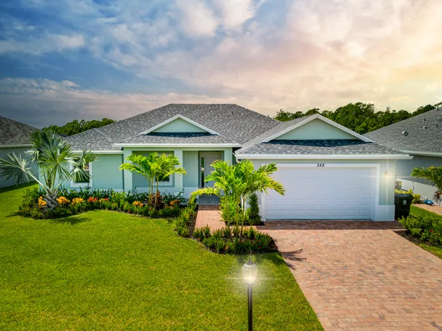 an aerial view of a house with a lake view