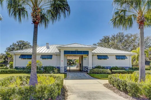 a view of a swimming pool with an outdoor seating