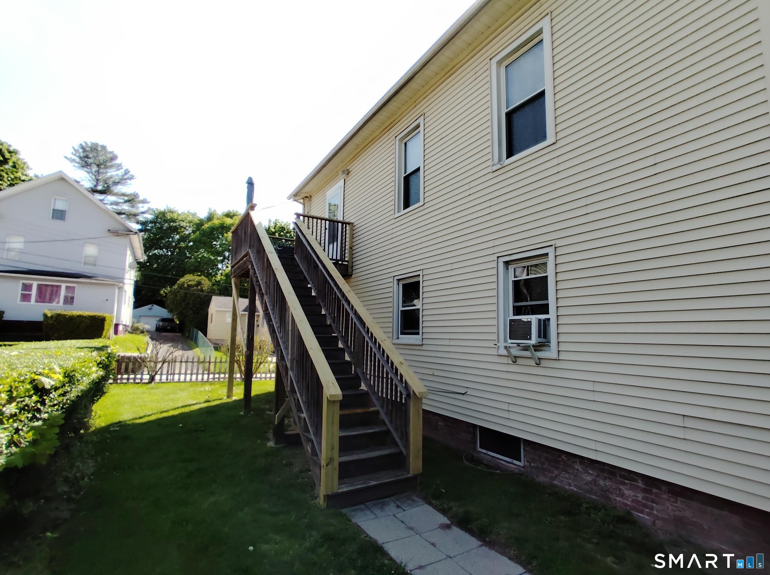 61 Bartlett Street Meriden, CT 06451 - Photo 7 of 30 a view of a house with a backyard