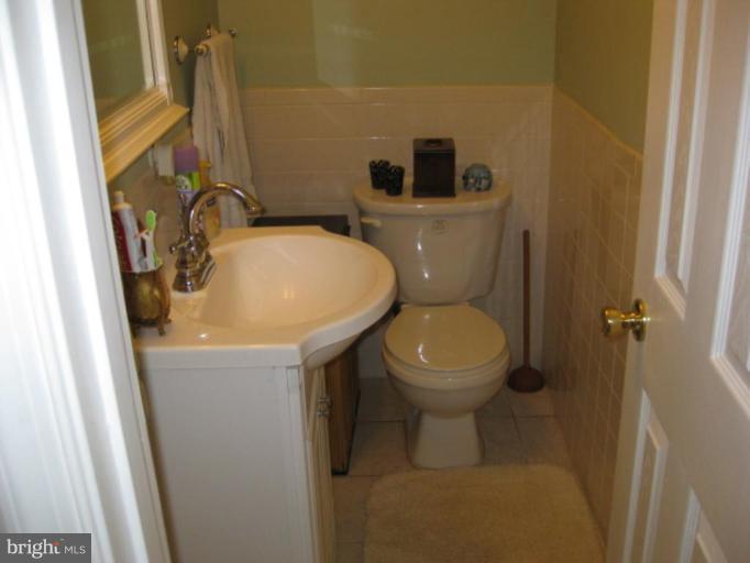 5209 Heming Avenue Springfield, VA 22151 - Photo 13 of 18 a bathroom with a toilet and a sink