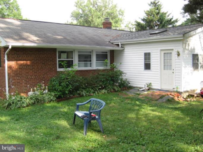 5209 Heming Avenue Springfield, VA 22151 - Photo 17 of 18 a backyard of a house with table and chairs