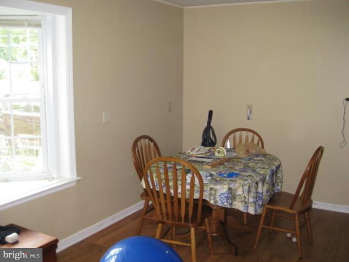 5209 Heming Avenue Springfield, VA 22151 - Photo 3 of 18 a view of a dining room with furniture and wooden floor