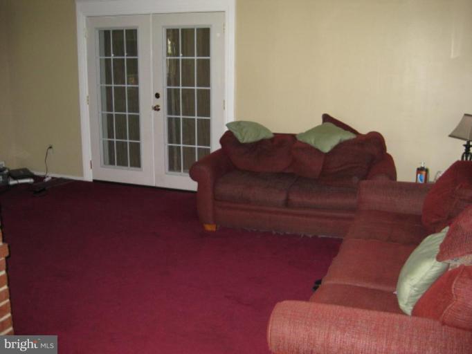 5209 Heming Avenue Springfield, VA 22151 - Photo 4 of 18 a living room with furniture and a window