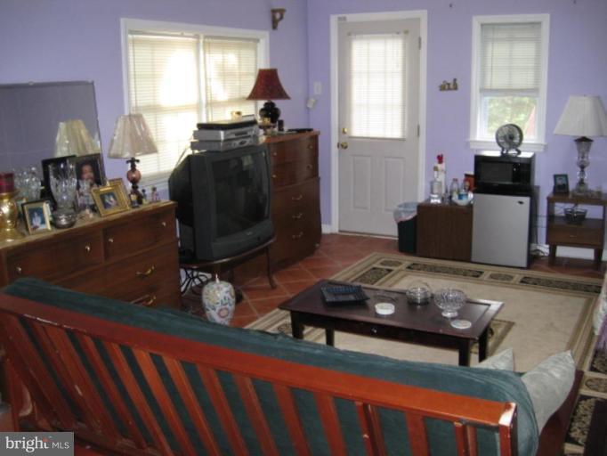 5209 Heming Avenue Springfield, VA 22151 - Photo 9 of 18 a living room with furniture and wooden floor