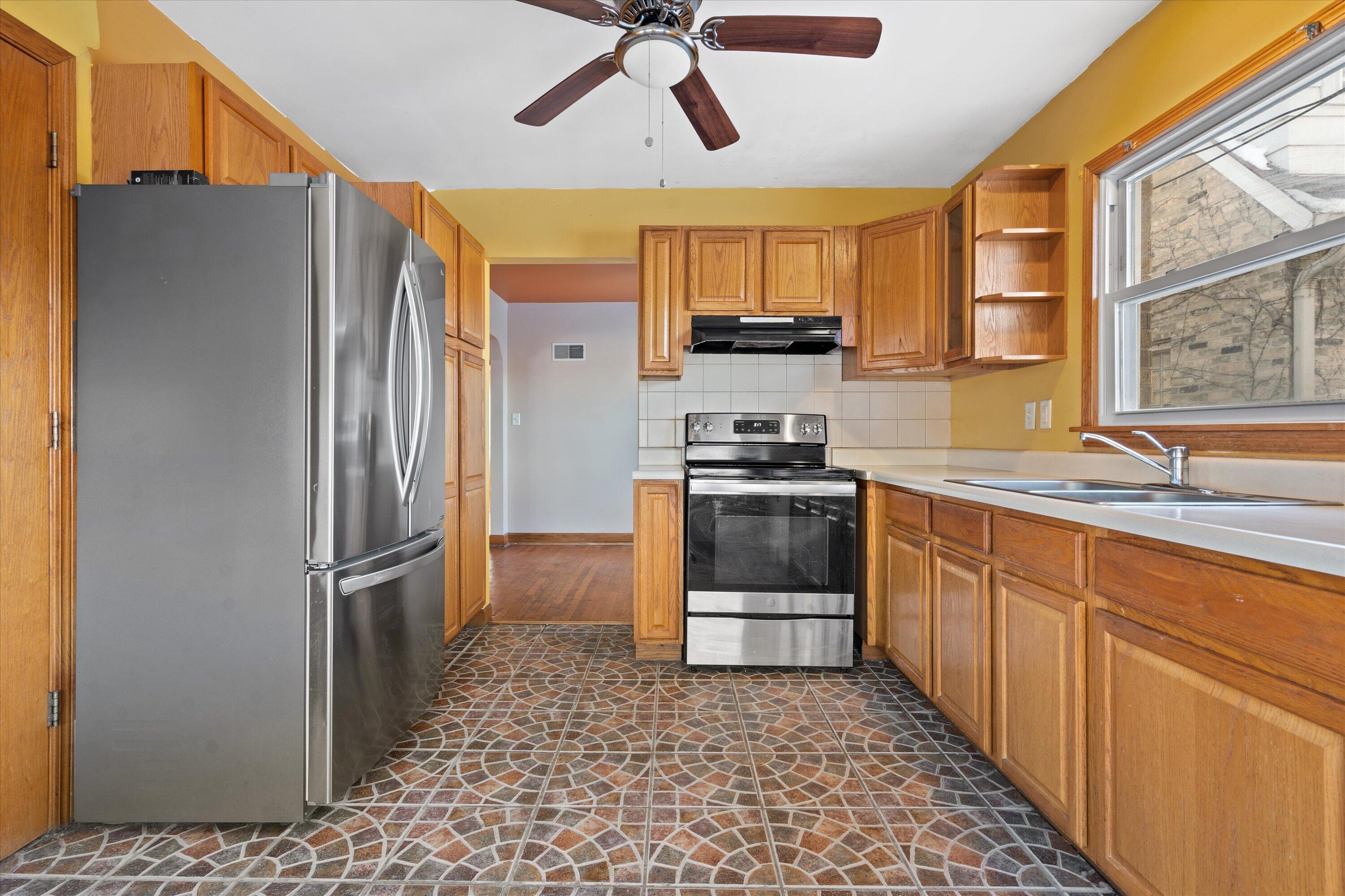 3955 North 46th Street Milwaukee, WI 53216 - Photo 8 of 25 Kitchen opens to dining room