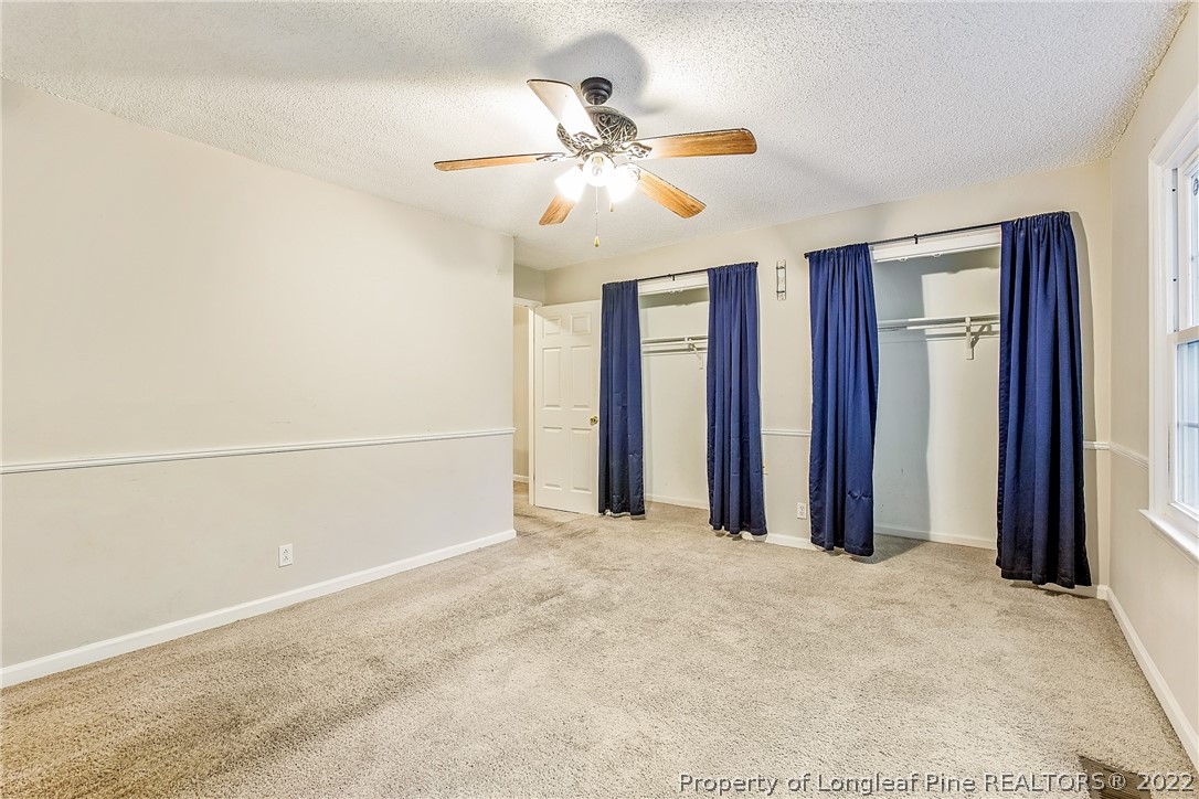 595 Winding Creek Road, Unit B Fayetteville, NC 28305 - Photo 14 of 17 a view of a livingroom with a ceiling fan and window