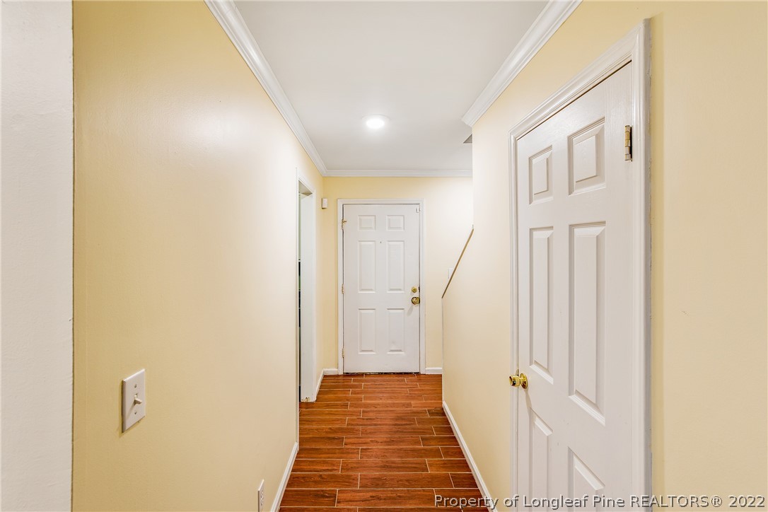 595 Winding Creek Road, Unit B Fayetteville, NC 28305 - Photo 2 of 17 a view of a hallway with wooden floor and staircase
