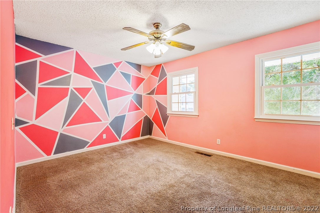 595 Winding Creek Road, Unit B Fayetteville, NC 28305 - Photo 9 of 17 a room with window and a ceiling fan