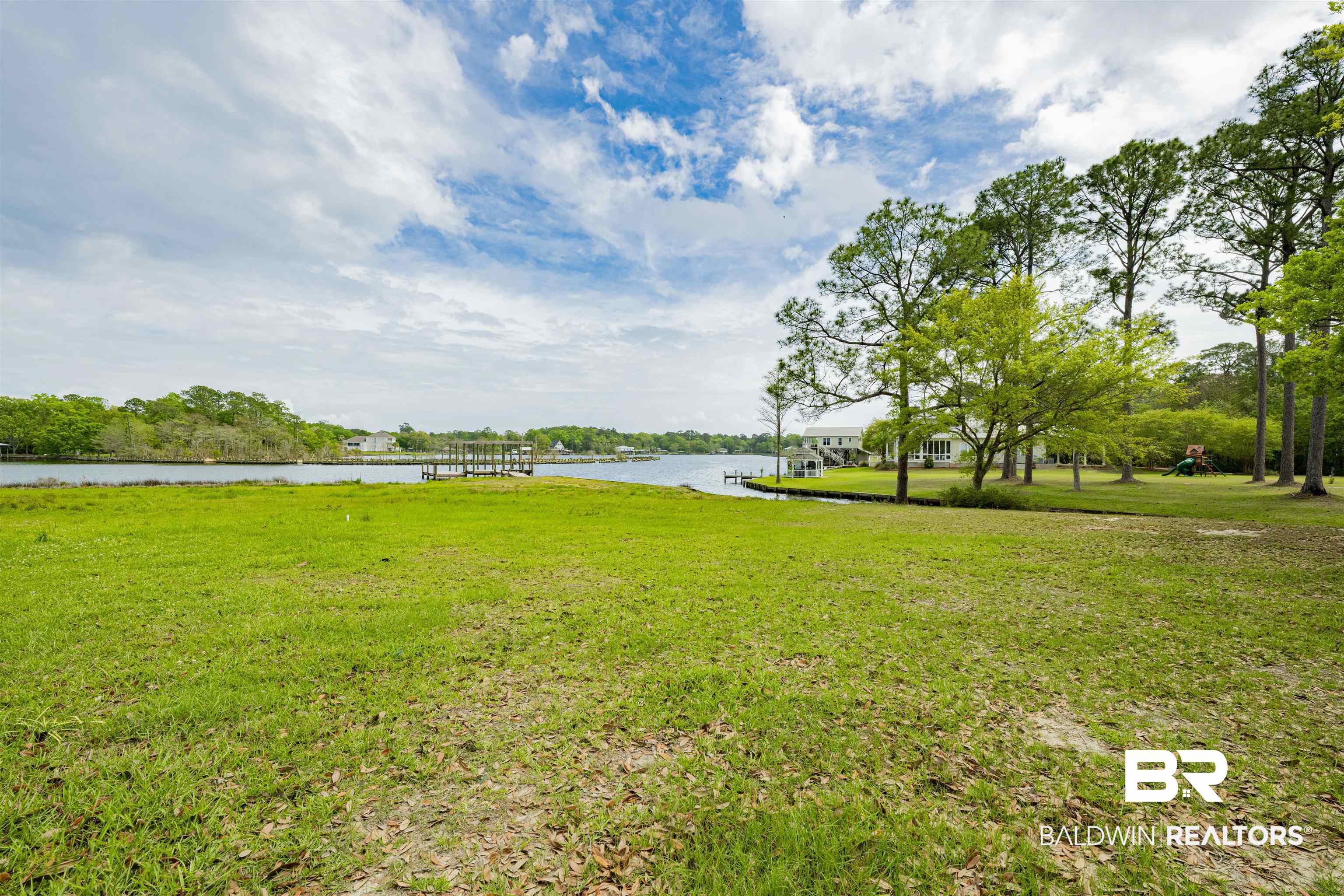 0 South Windsor Road South Theodore, AL 36582 - Photo 13 of 22 View of green lawn featuring a water view