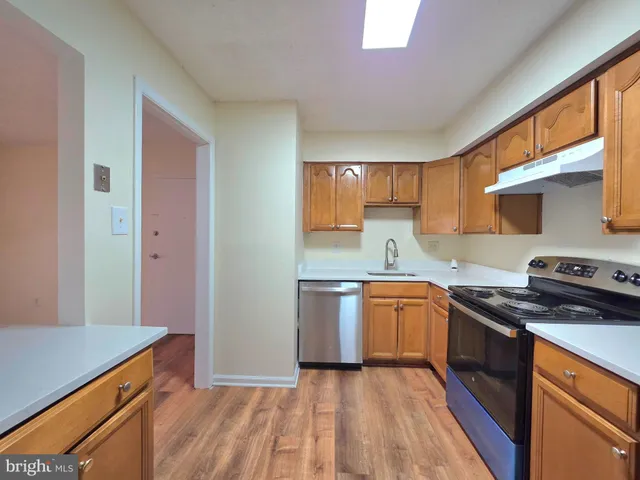 a view of a hallway with washer and dryer