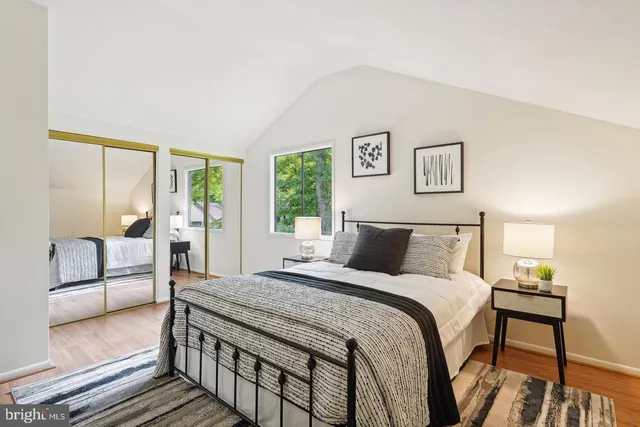 a bedroom with a large bed and a view of bedroom