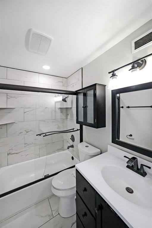 3060 Pharr Road Northwest, Unit 114 Atlanta, GA 30305 - Photo 9 of 16 a bathroom with a sink a toilet and shower