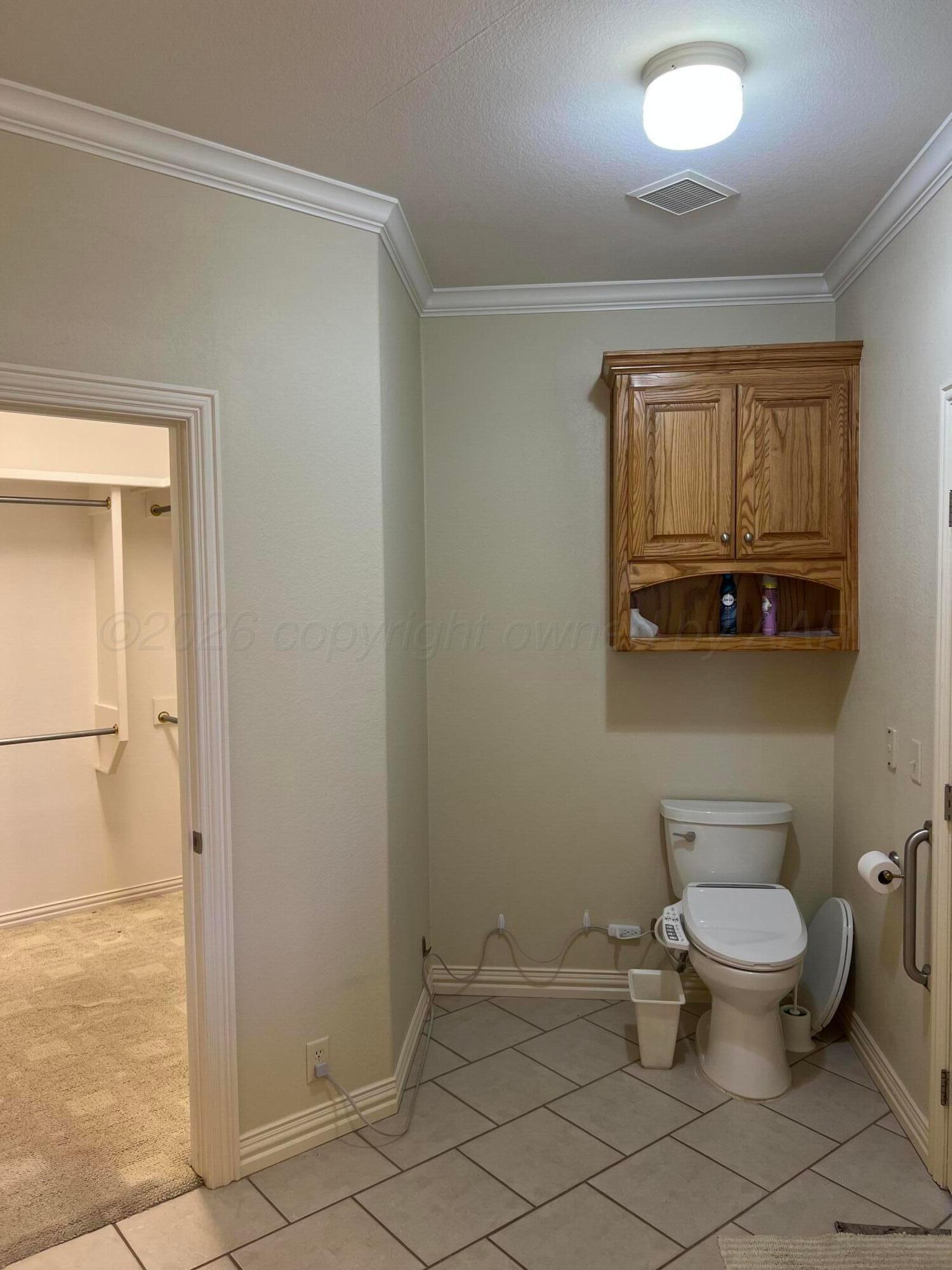 8405 Addison Drive Amarillo, TX 79119 - Photo 12 of 18 a bathroom with a toilet