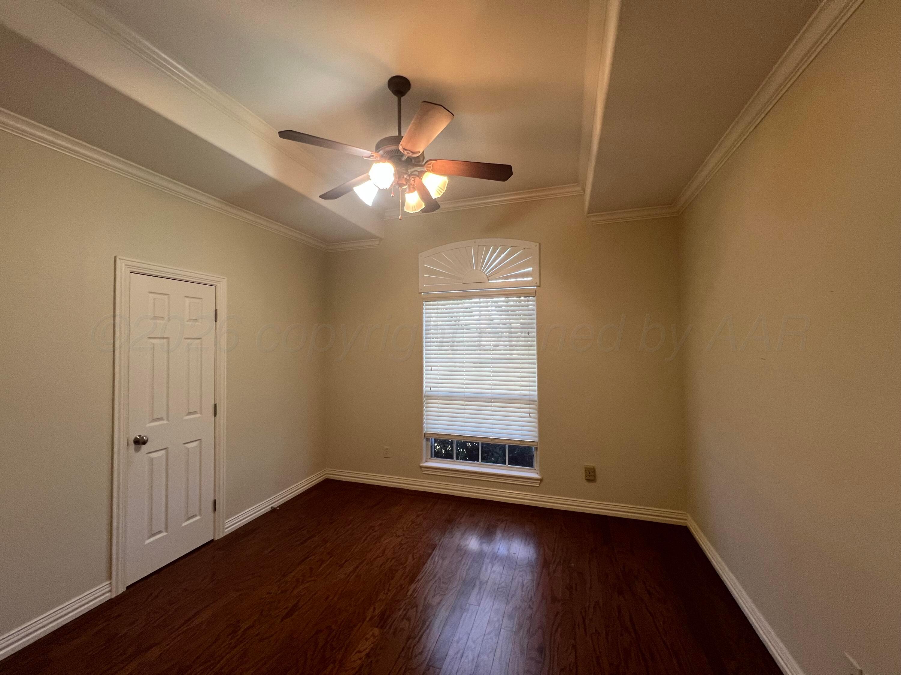 8405 Addison Drive Amarillo, TX 79119 - Photo 15 of 18 wooden floor in an empty room with a window