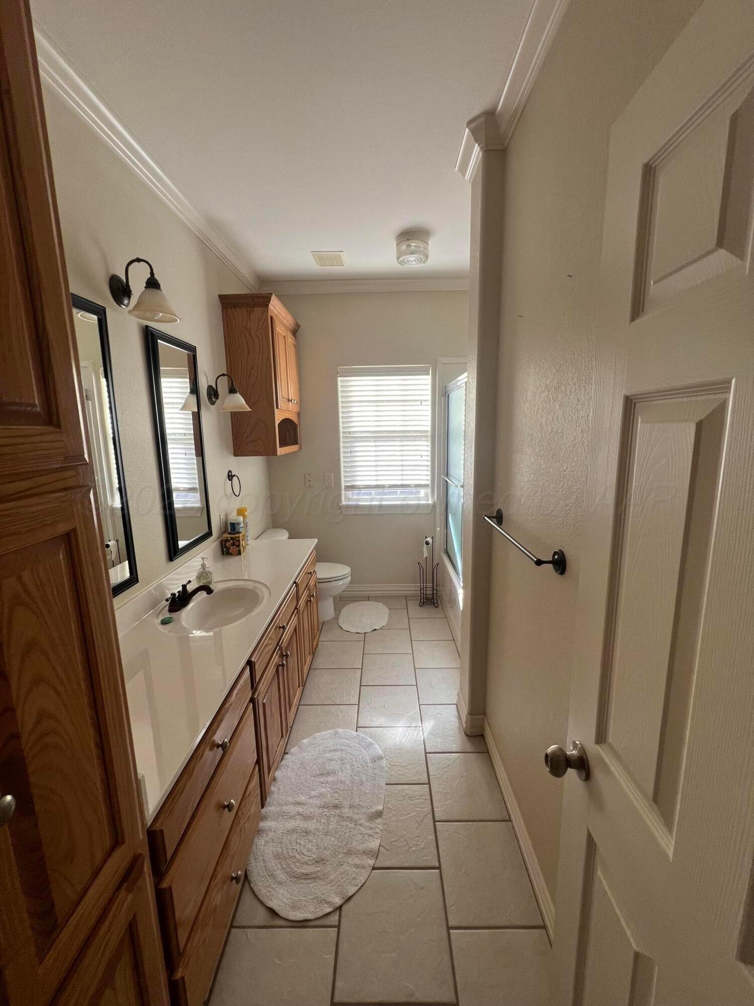 8405 Addison Drive Amarillo, TX 79119 - Photo 17 of 18 walk in closet with window