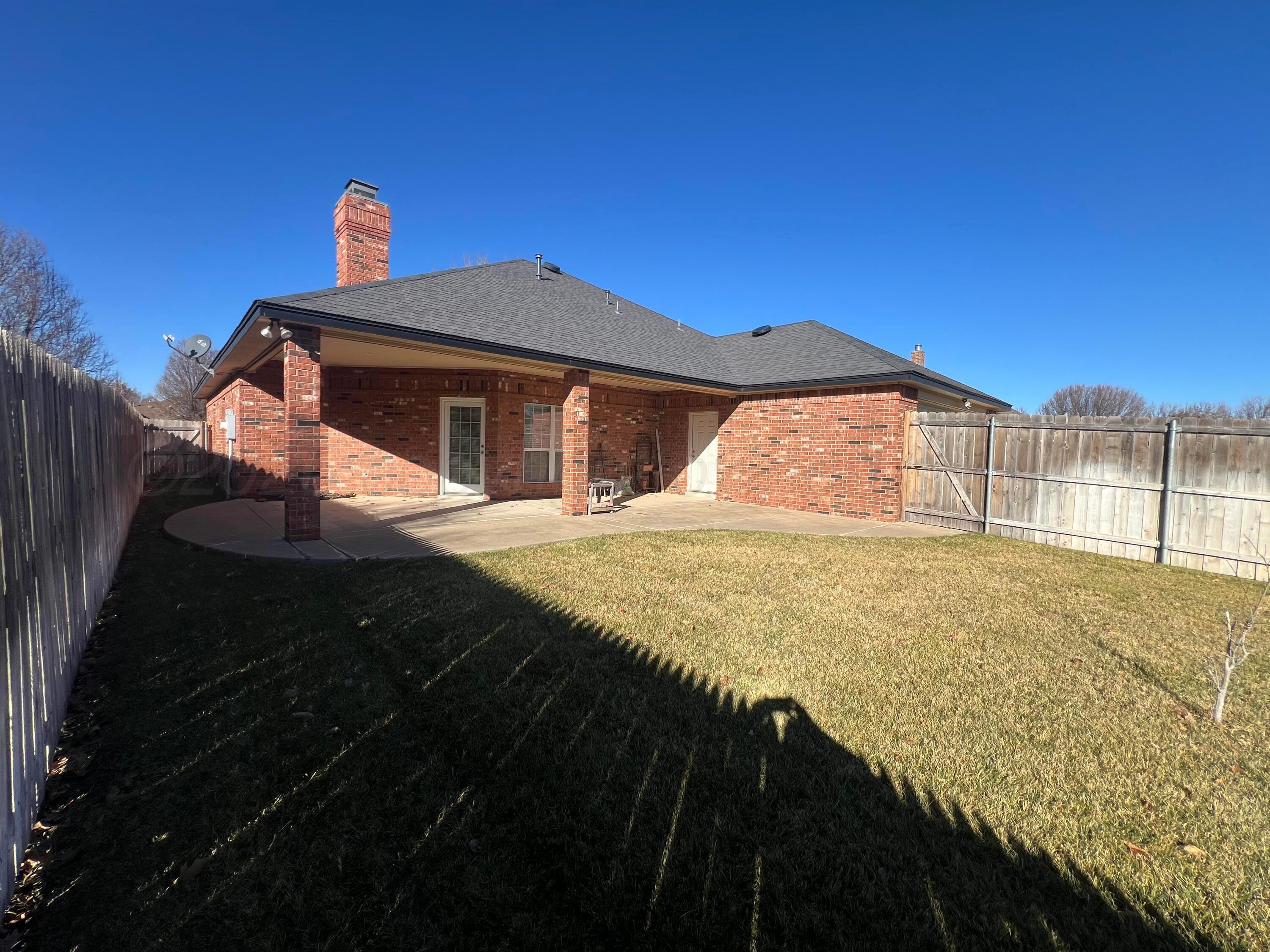 8405 Addison Drive Amarillo, TX 79119 - Photo 18 of 18 a front view of a house with a yard
