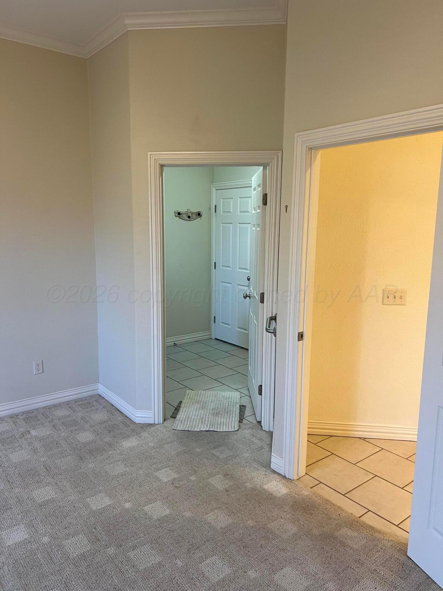 8405 Addison Drive Amarillo, TX 79119 - Photo 7 of 18 an empty room with a door