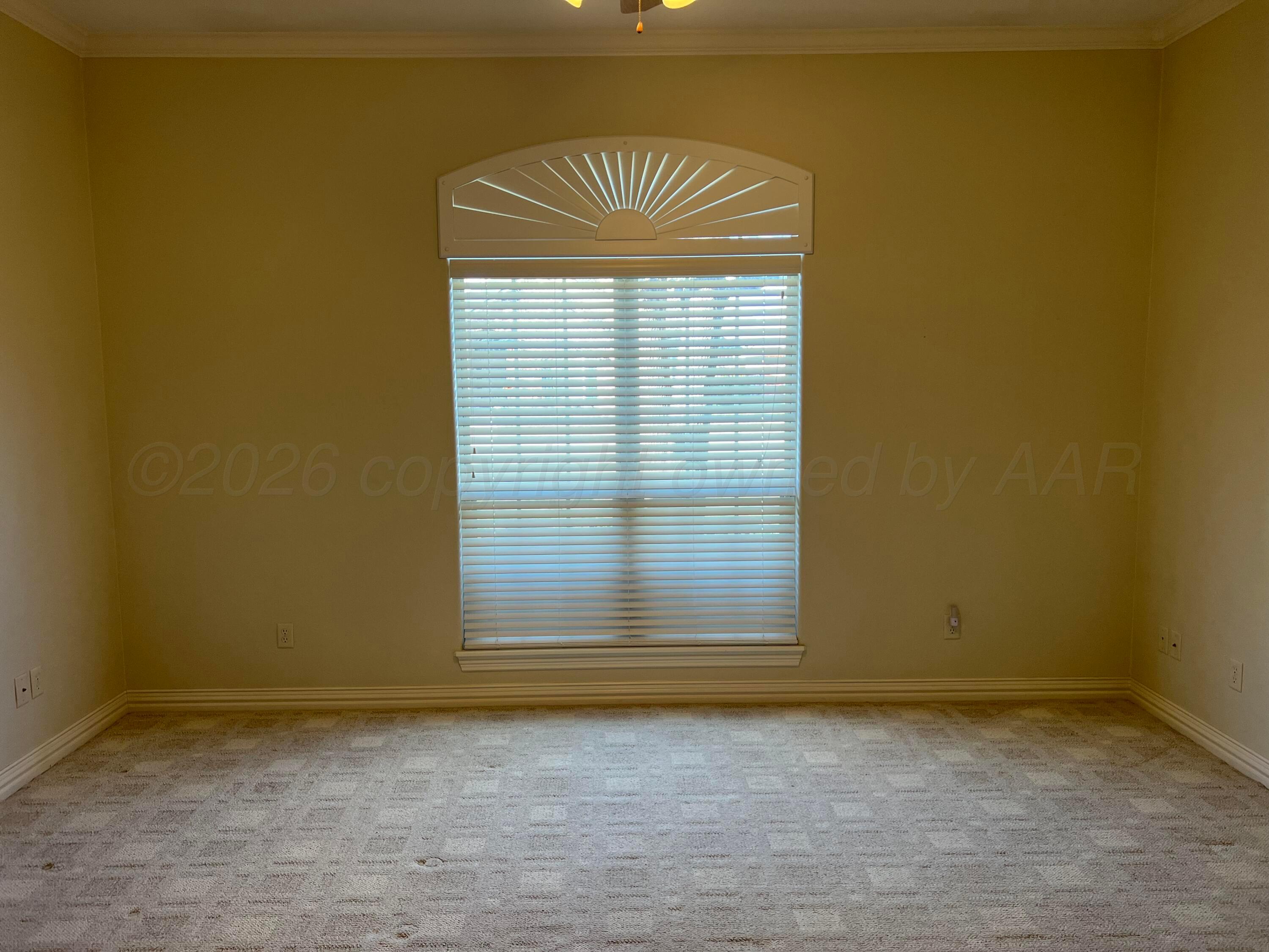 8405 Addison Drive Amarillo, TX 79119 - Photo 8 of 18 a view of an empty room with a window