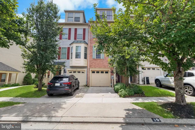 a car parked in front of a brick house