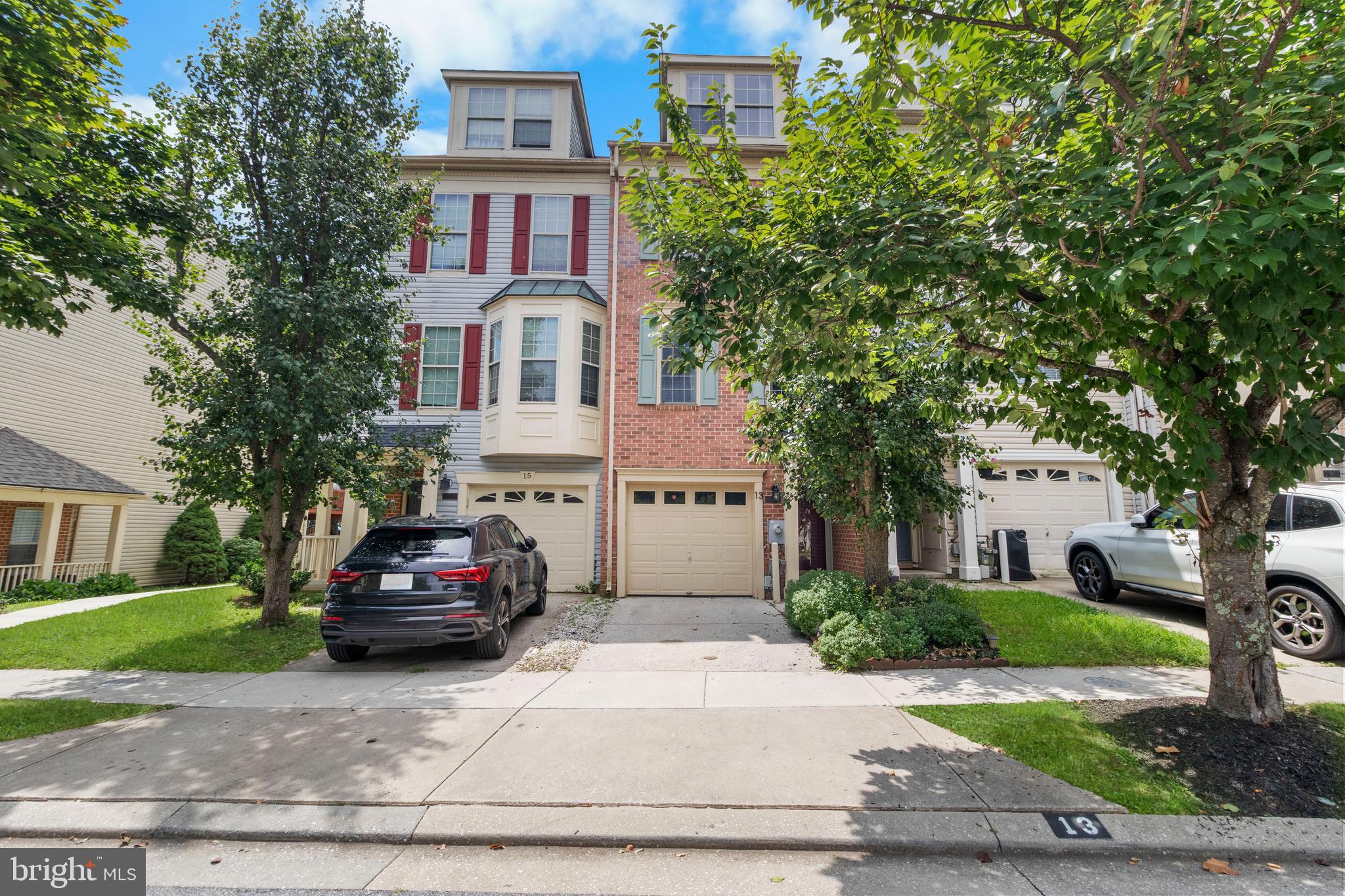 13 Bank Spring Court Owings Mills, MD 21117 - Photo 1 of 50 a car parked in front of a brick house
