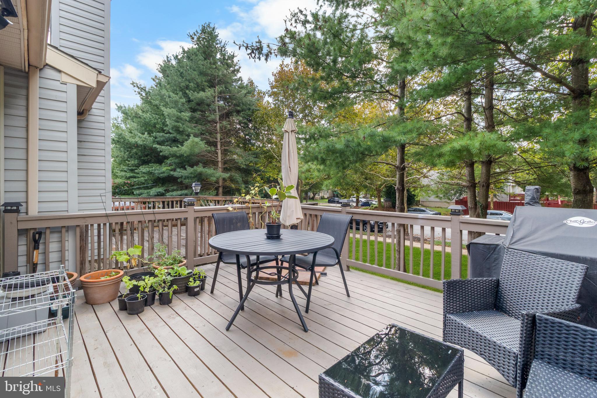 13 Bank Spring Court Owings Mills, MD 21117 - Photo 20 of 50 a view of a deck with furniture and trees