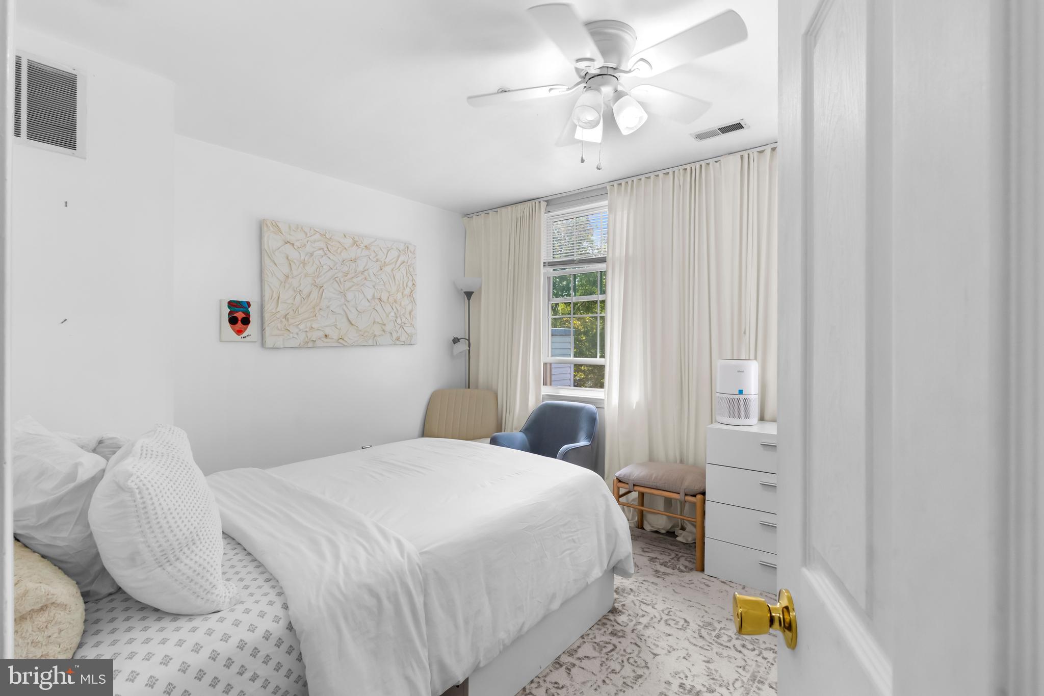 13 Bank Spring Court Owings Mills, MD 21117 - Photo 22 of 50 a bedroom with a bed and a chandelier