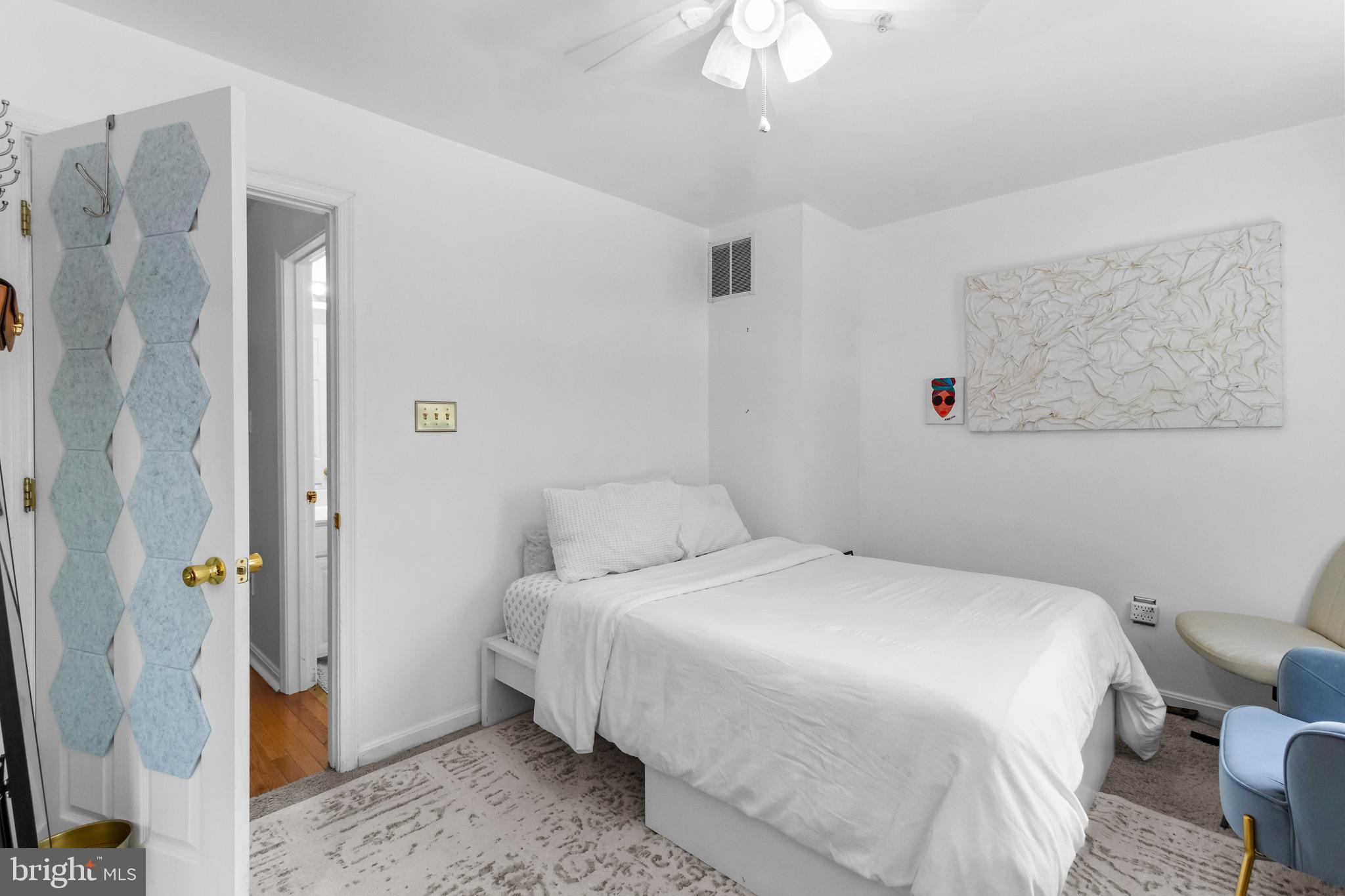 13 Bank Spring Court Owings Mills, MD 21117 - Photo 23 of 50 a bedroom with a bed and a chandelier